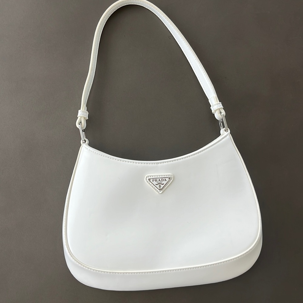 Cowhide skin like brand Prada summer must have bag